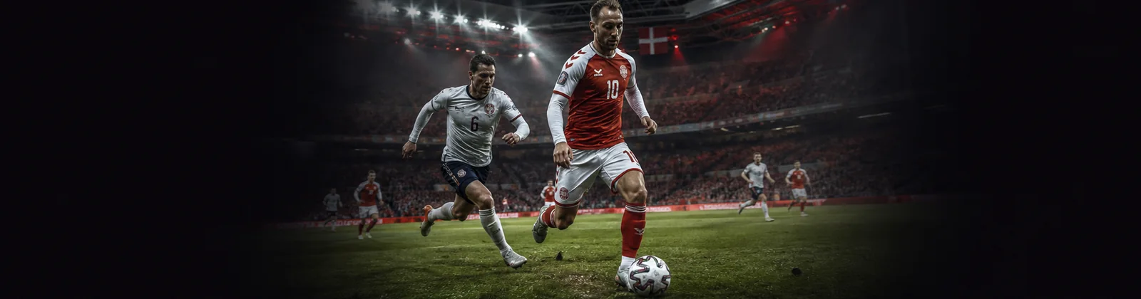Voksne fodboldspillere midt på et dansk stadion